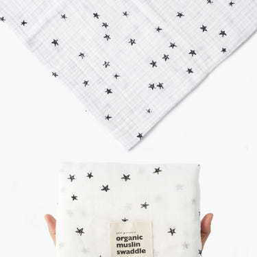 Organic Muslin Swaddle featuring a star pattern, perfect for wrapping your baby in comfort and style.