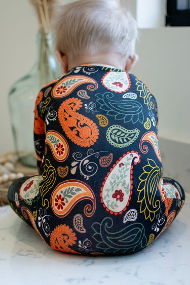 Paisley Bamboo Viscose Zippies for babies, soft and stylish toddler clothing in a vibrant design.