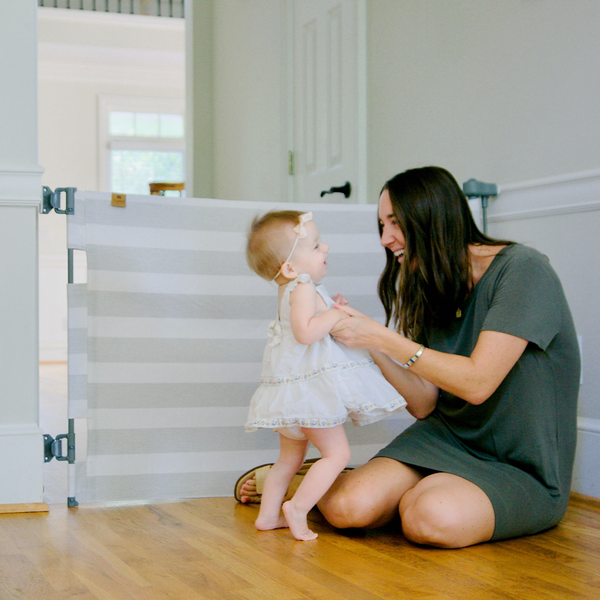 Stylish Crypton® Fabric Baby Gate, stain-resistant & PFAS-free, fits openings 27.6"-55", stands 33" tall.