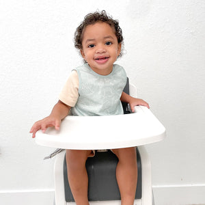Dino Friends Sage Bapron for preschoolers on sale, angled view showcasing fun dinosaur design.
