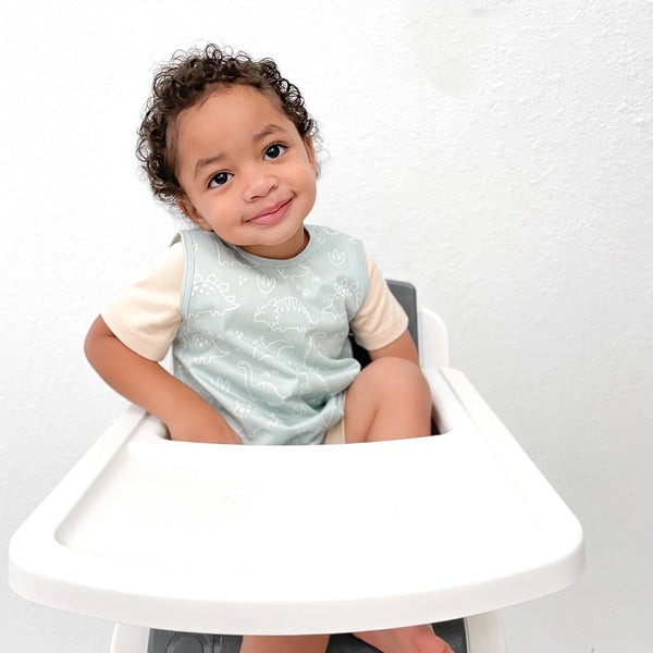 Dino Friends Sage Bapron for preschoolers on sale, shown from angle 2. Perfect for messy mealtimes!