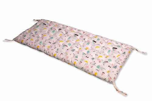 Unique climbing arch pillow with vibrant cushion designs for babies, angled view showcasing comfort and style.