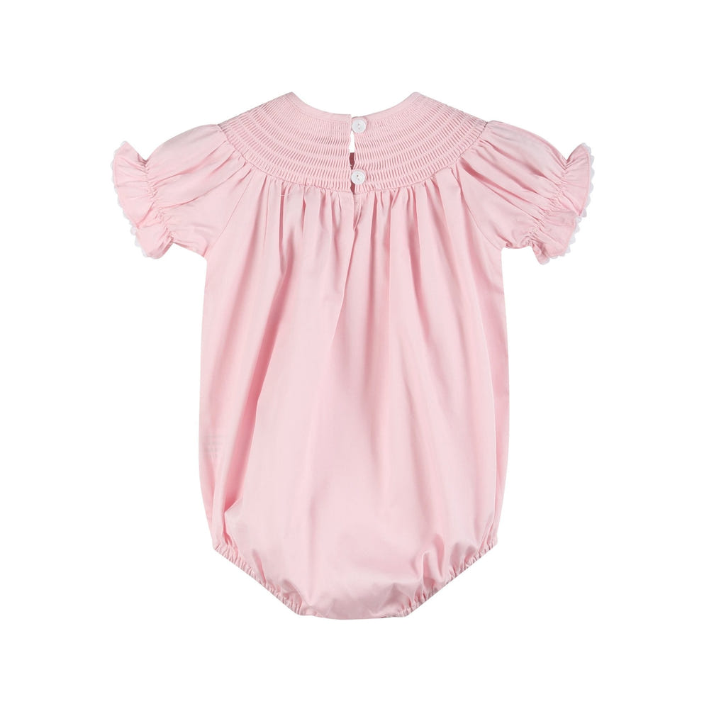 Pink and white smocked bubble romper for babies, perfect for stylish and comfortable playtime.