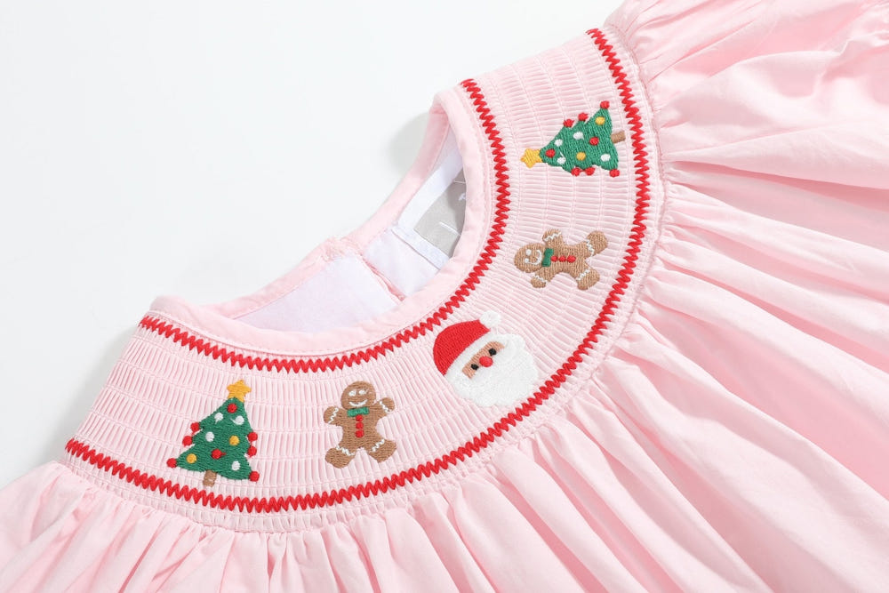 Pink Christmas smocked bishop dress for babies, perfect for festive celebrations and holiday gatherings.