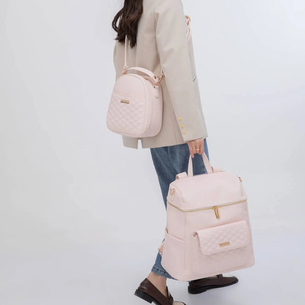 Pastel pink signature diaper bag at angle 10, stylish and functional for modern parents.