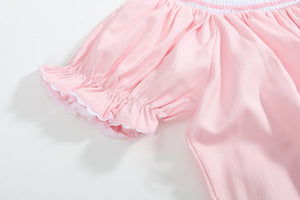 Pink Hearts & Bows Smocked Bishop Dress for babies, featuring a charming design and elegant smocking details.