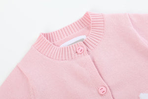 Pink knit Easter bunny cardigan for babies, featuring a cute design and cozy fit, showcased at an angle.
