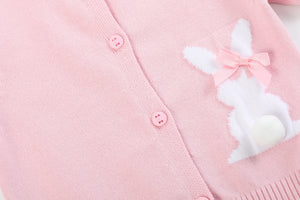 Pink knit Easter bunny cardigan for babies, cozy and adorable, shown from angle 3. Perfect for spring outfits.