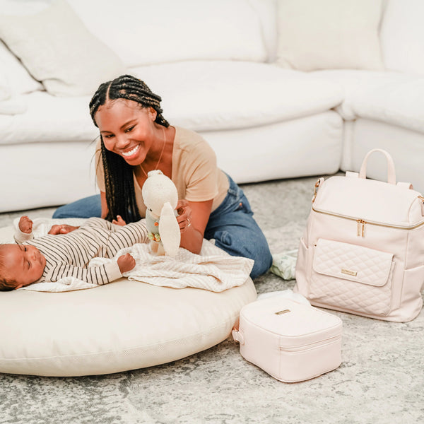 Pastel pink Signature Diaper Bag at angle 12, stylish and functional for modern parents.