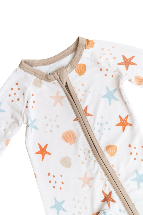 Sandy Toes Zipper Lounger for babies in soft fabric, perfect for cozy lounging and playtime. Angle 5 view.