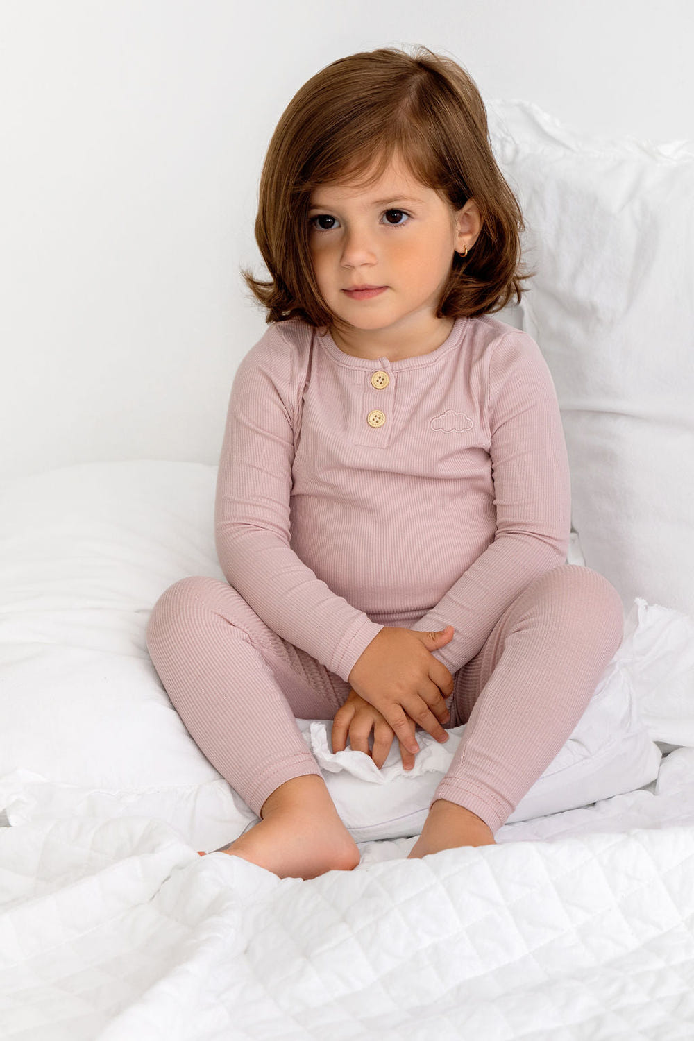 Blush Henley PJ for babies, cozy sleepsuit perfect for comfortable nighttime wear.
