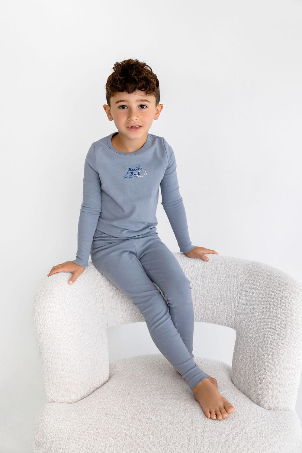 Bonne Nuit PJ in Dusty Blue for babies - cozy sleepsuit perfect for a restful night's sleep.