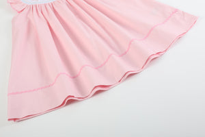 Pretty Pink Easter Bunny Smocked Bishop Dress for babies, showcasing a charming design from angle 2.