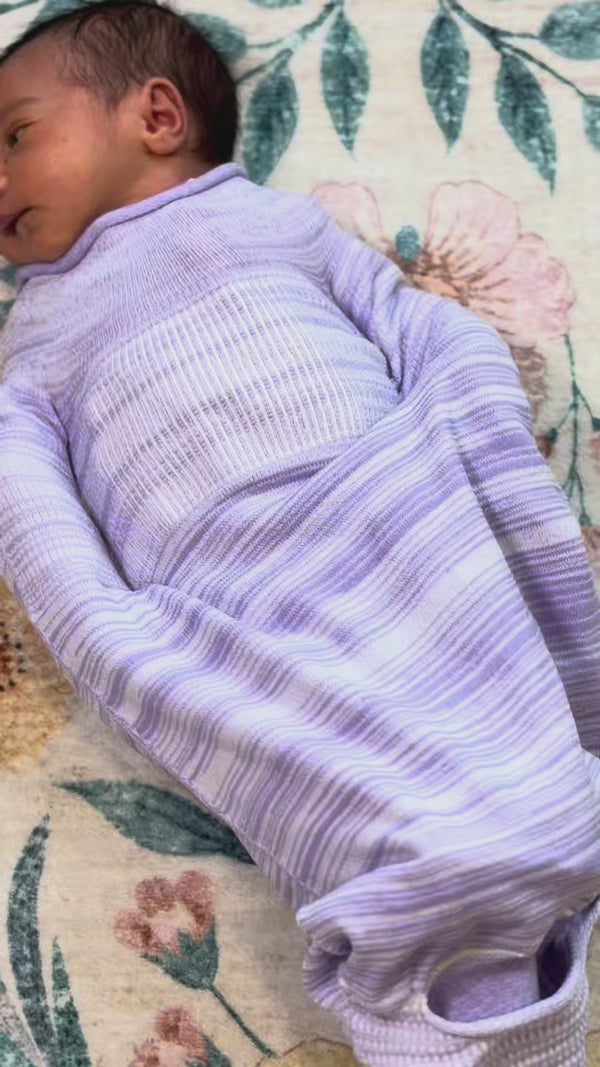 a baby with swaddle