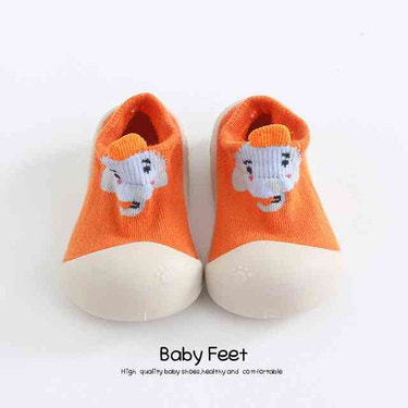Orange dog animal sock shoes for babies - cute and comfy footwear for little ones.