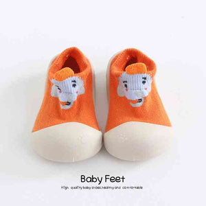 Orange dog animal sock shoes for babies - cute and comfy footwear for little ones.