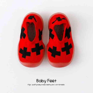 Red and black baby sock shoes, perfect for little feet, stylish and comfortable for everyday wear.