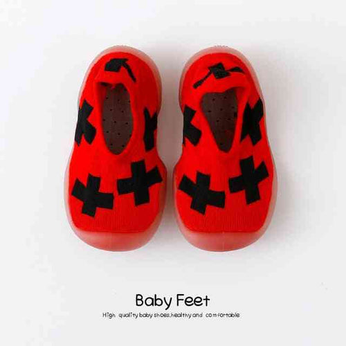 Red and black baby sock shoes, perfect for little feet, stylish and comfortable for everyday wear.