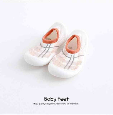 Modern pink baby sock shoes, perfect for little feet. Stylish and comfortable footwear for infants.