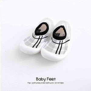 Modern gray baby sock shoes, perfect for stylish comfort and support. Ideal for little feet in any season.