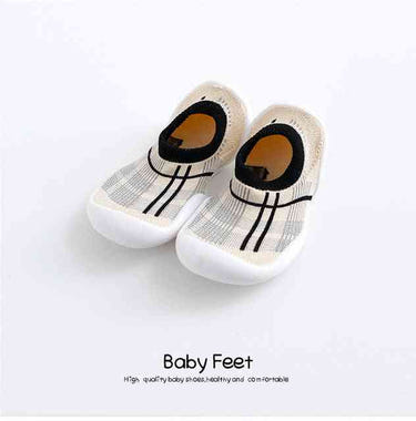 Modern white baby sock shoes, perfect for stylish comfort and support. Ideal for little ones' first steps.