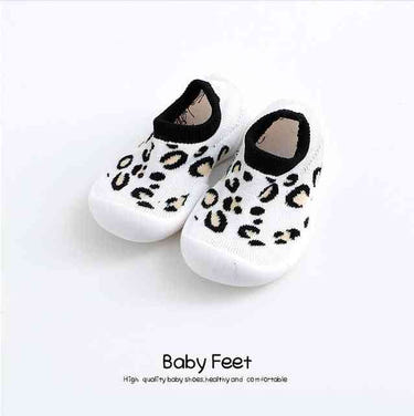 White leopard baby sock shoes, perfect for stylish and comfortable little feet. Ideal for infants and toddlers.
