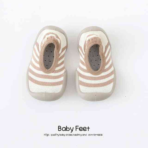 Tan lines baby sock shoes, perfect for little feet. Stylish and comfortable footwear for infants.