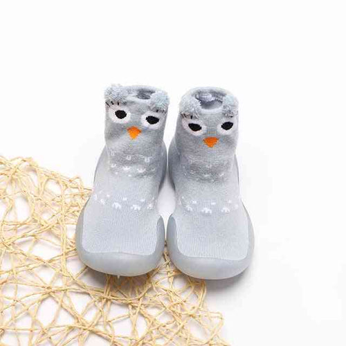 Cute owl-patterned long shoe socks for babies, perfect for keeping tiny feet warm and stylish.