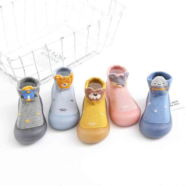 Cute lion-pattern baby sock shoes, perfect for tiny feet and playful adventures. Angle view showcasing design details.