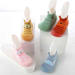 Blue monster-themed baby sock shoes, perfect for tiny feet and playful adventures. Angle 3 view.
