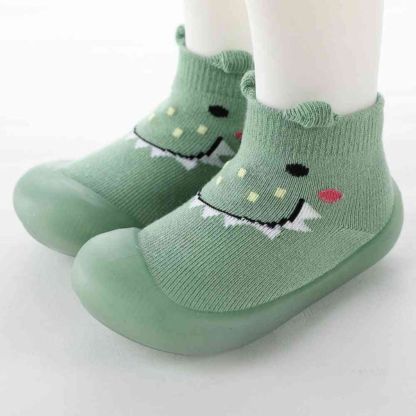 Baby Pet Sock Shoes in Monster Green, angle 2 view, perfect for tiny feet and playful adventures.