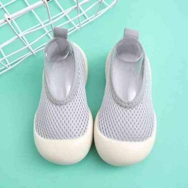 Light gray baby first walkers - stylish and comfortable shoes for your little one's first steps.