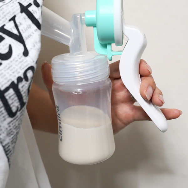 M1 Manual Breast Pump Kit from angle 2, perfect for feeding and nursing convenience.