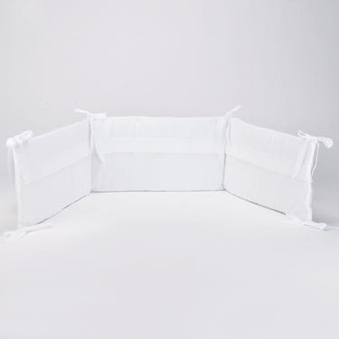 "PURITY Baby White Cotton Bed Bumper - Soft, safe bedding accessory for a cozy nursery."