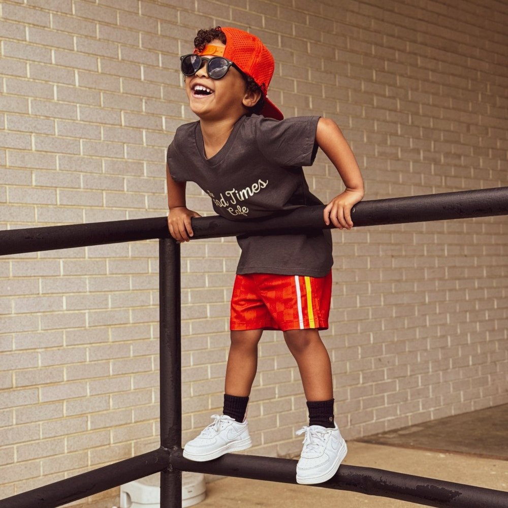 Retro-wave hybrid board shorts in red and orange for babies and toddlers. Perfect for summer fun!