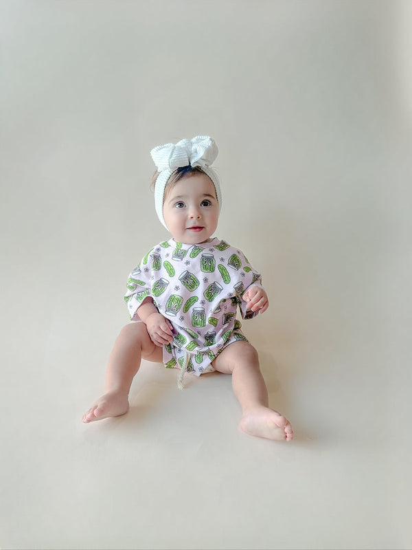 Baby shorts set featuring playful pickles design, angled view showcasing vibrant colors and comfortable fit.