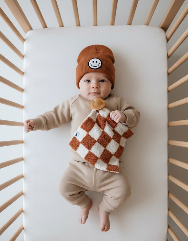 Checkered plush lovey in copper, perfect for comforting babies and enhancing their cuddle time.