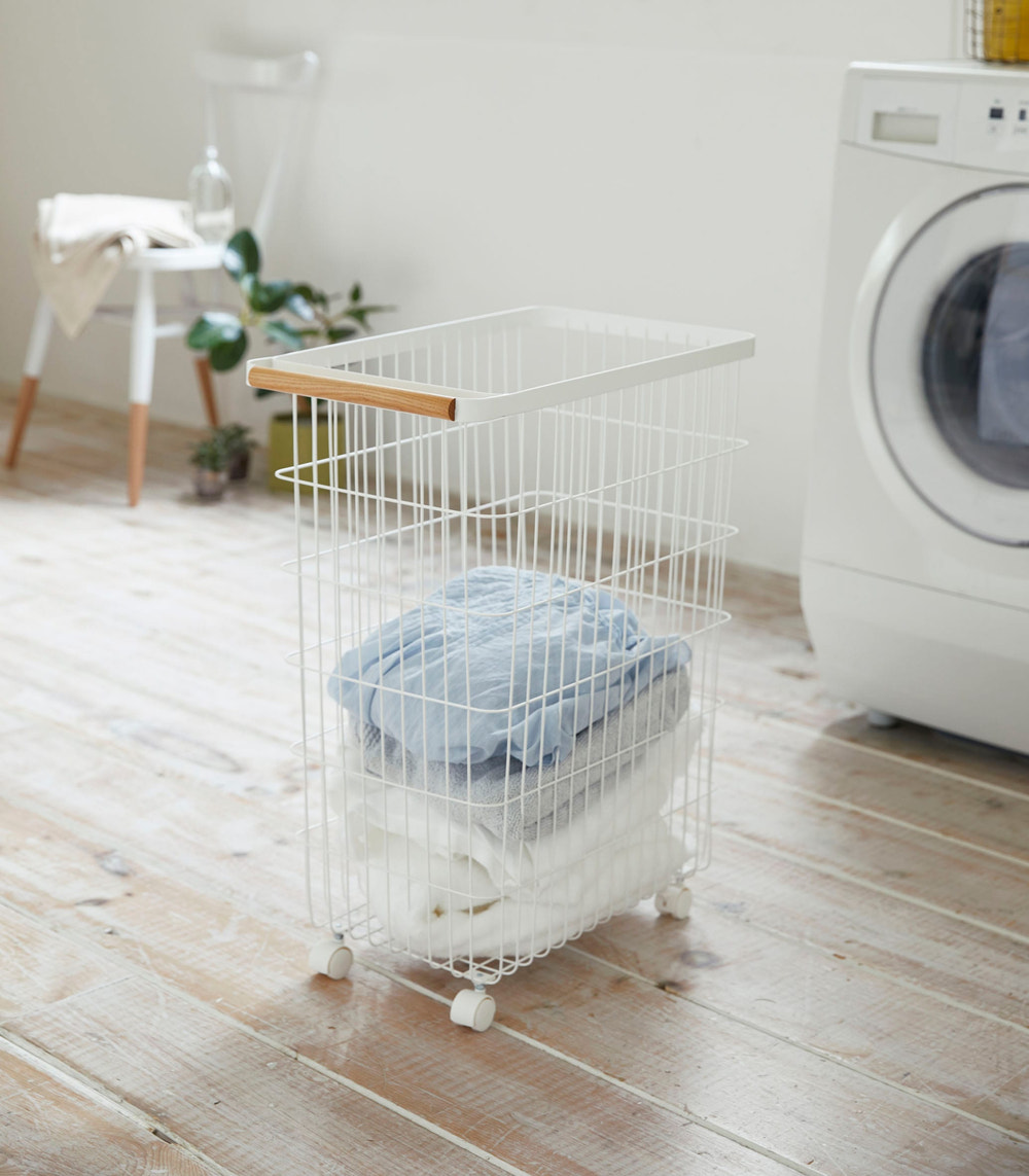 Rolling wire basket with wood accents, 24" H, perfect for laundry and storage solutions.