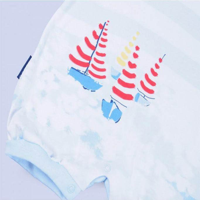 Sailboat romper for babies, featuring a playful nautical design, perfect for summer outings and playtime.