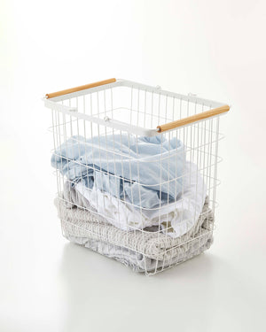 Stylish steel and wood wire laundry basket set in two sizes, viewed from angle 6. Perfect for organizing baby essentials.