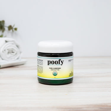 Pure, unrefined organic shea butter in a jar for baby wellness and skincare.