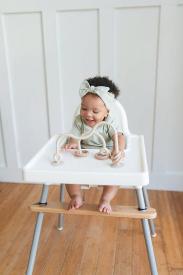 Silicone highchair toy in various colors, perfect for engaging babies during mealtime.