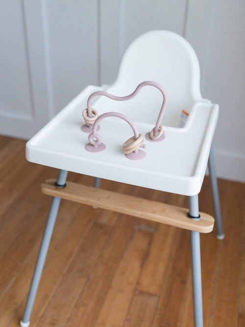 Silicone highchair toy in various colors, angle view 5, perfect for engaging babies during mealtime.