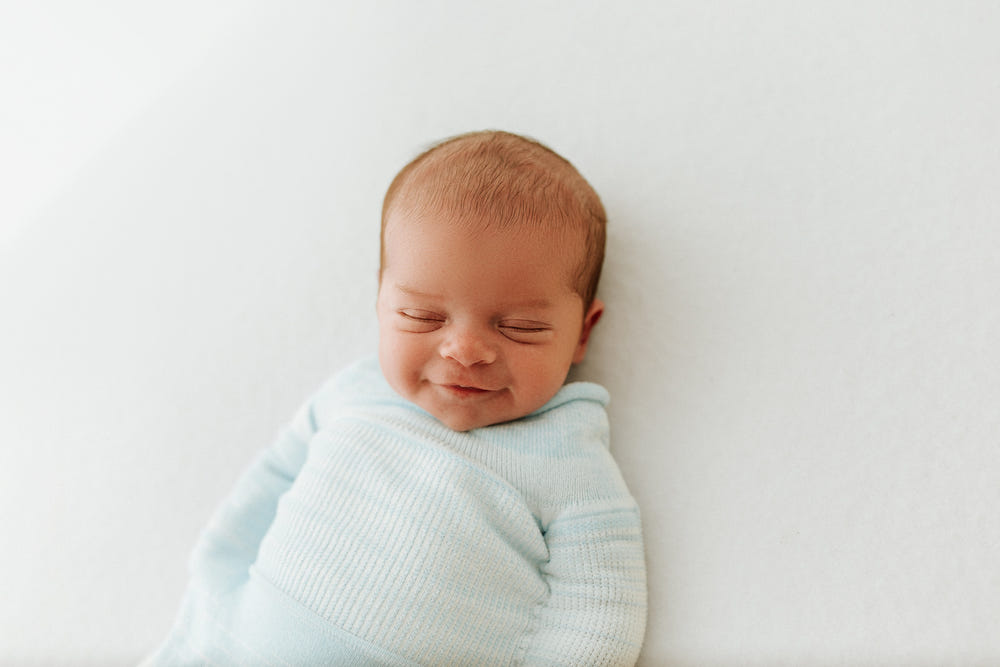 Blue Swaddle Sleep Sack from Swaddelini, perfect for keeping your baby cozy and secure during sleep.