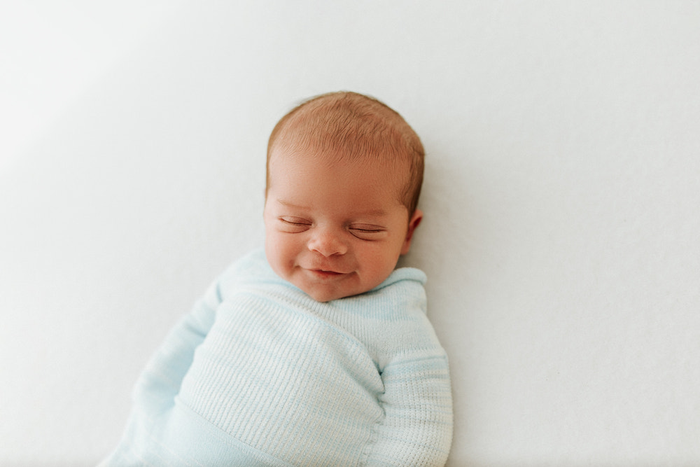 Blue Swaddle Sleep Sack from Swaddelini, perfect for keeping your baby cozy and secure during sleep.