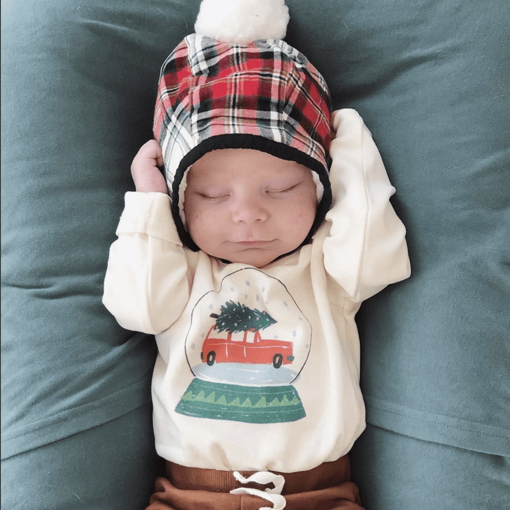 Long sleeve graphic bodysuit featuring a whimsical snow globe design for babies.