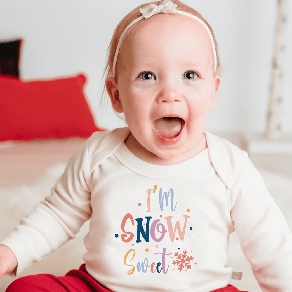 Long sleeve graphic bodysuit in "Snow Sweet" design for babies, perfect for cozy and stylish outfits.