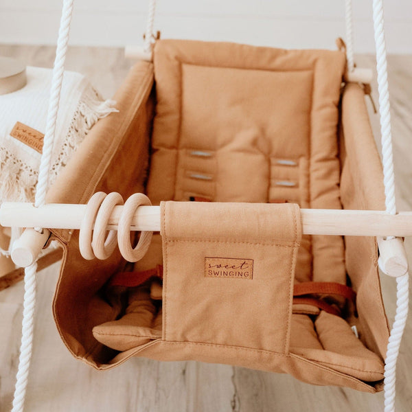 "Grow With Me Nutmeg swing at angle 2, perfect for babies to relax and play comfortably."