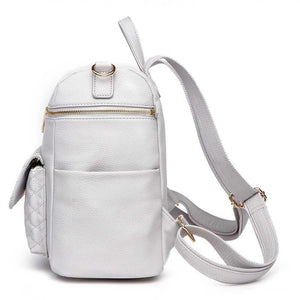 Stylish Petit Diaper Bag in Stone Grey, angled view showcasing its sleek design and practicality for parents.