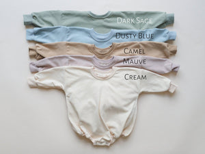 Sunday Funday Football Sweatshirt Romper in various colors, angle view showcasing stylish baby apparel.